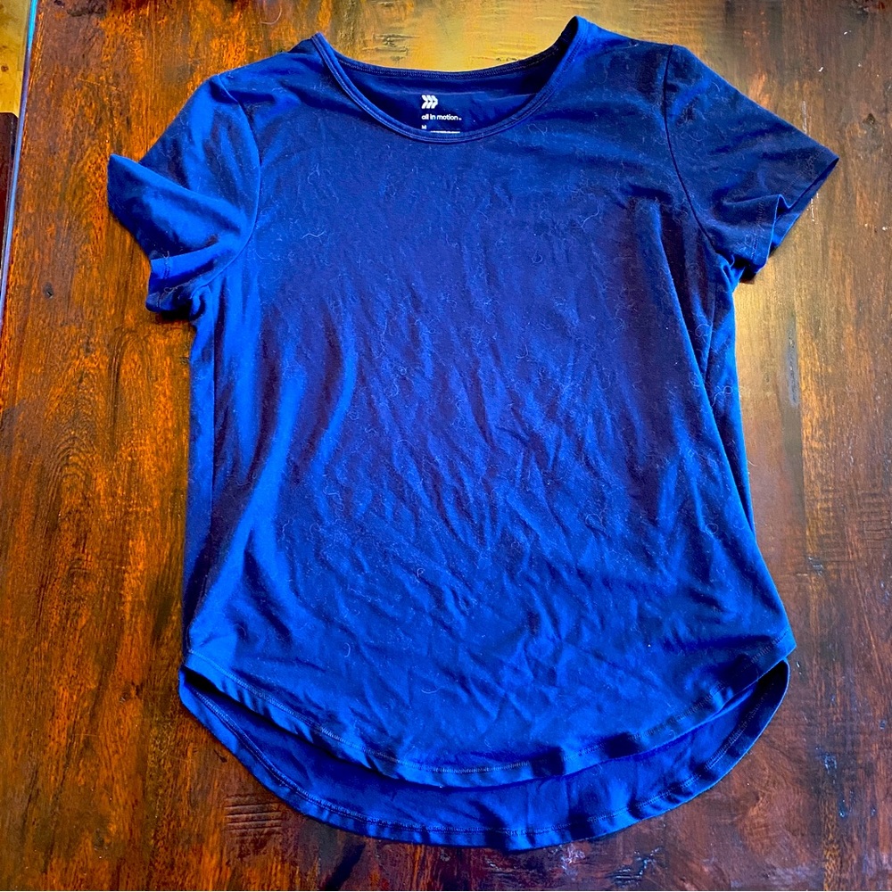 Very soft, navy blu t-shirt. High low style with cut sides.